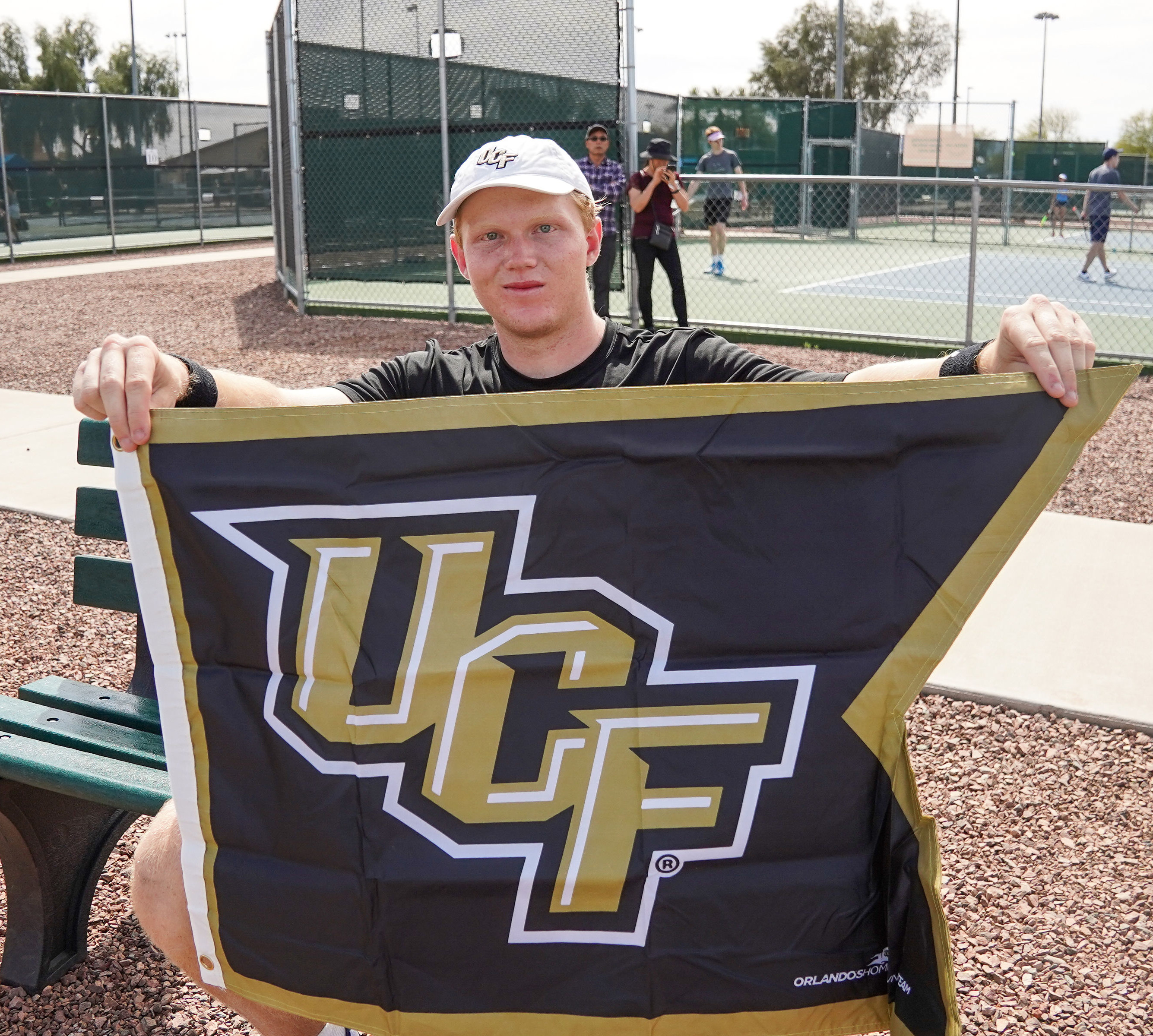 A picture of myself holding up a UCF flag.